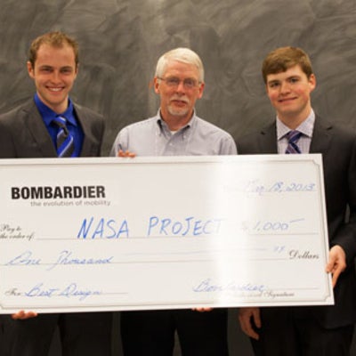 Best Design group  holding winning cheque