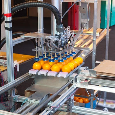 A robot lifting 20 oranges