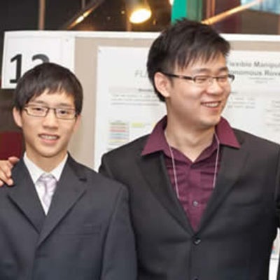 Four men smiling for the camera