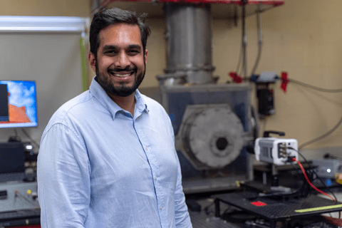 Portrait of Vinny Gupta smiling in front of enclosure