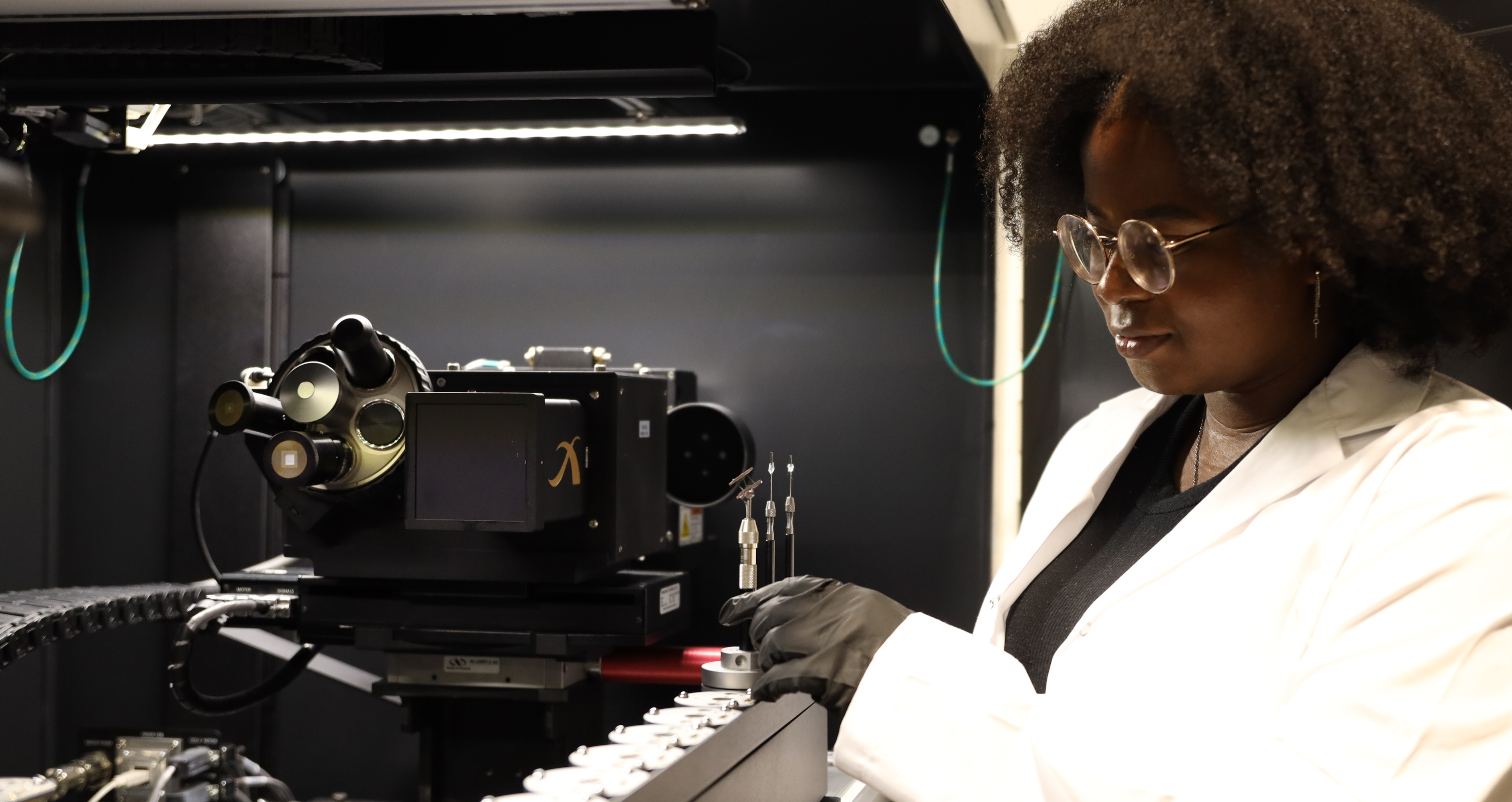 Student performing work in an additive manufacturing lab