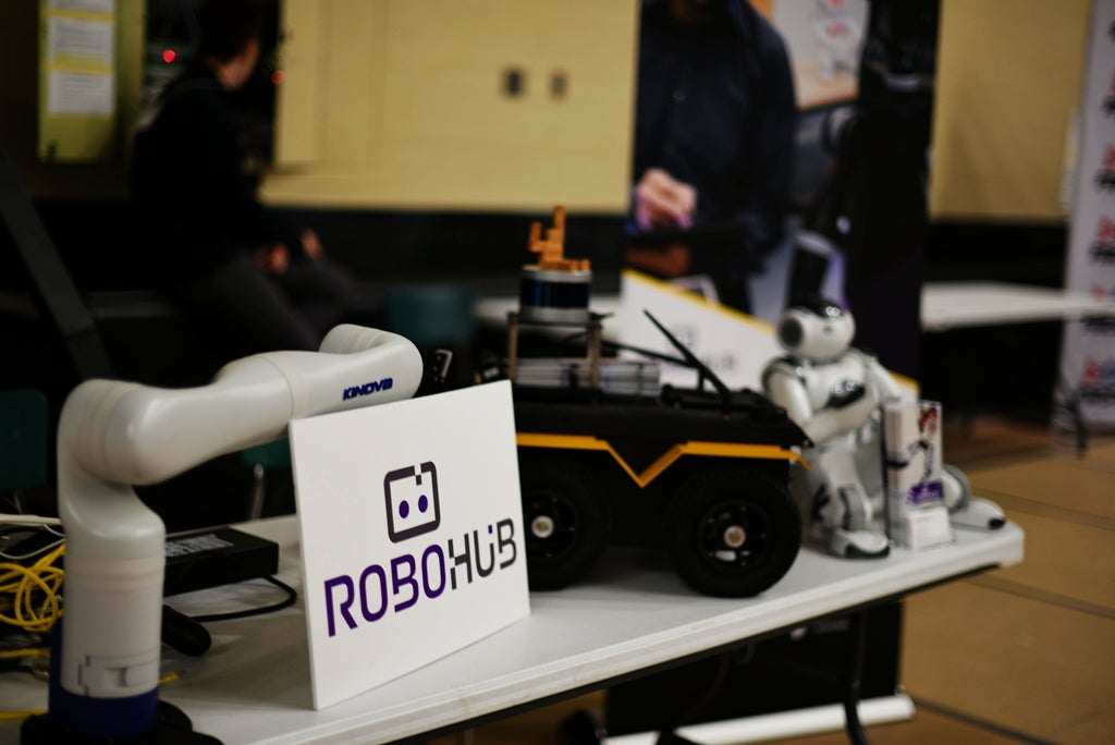RoboHub’s Booth: Marie Charbonneau, Robert Wagner, and Sagar Rajendran set-up and discussed robotics