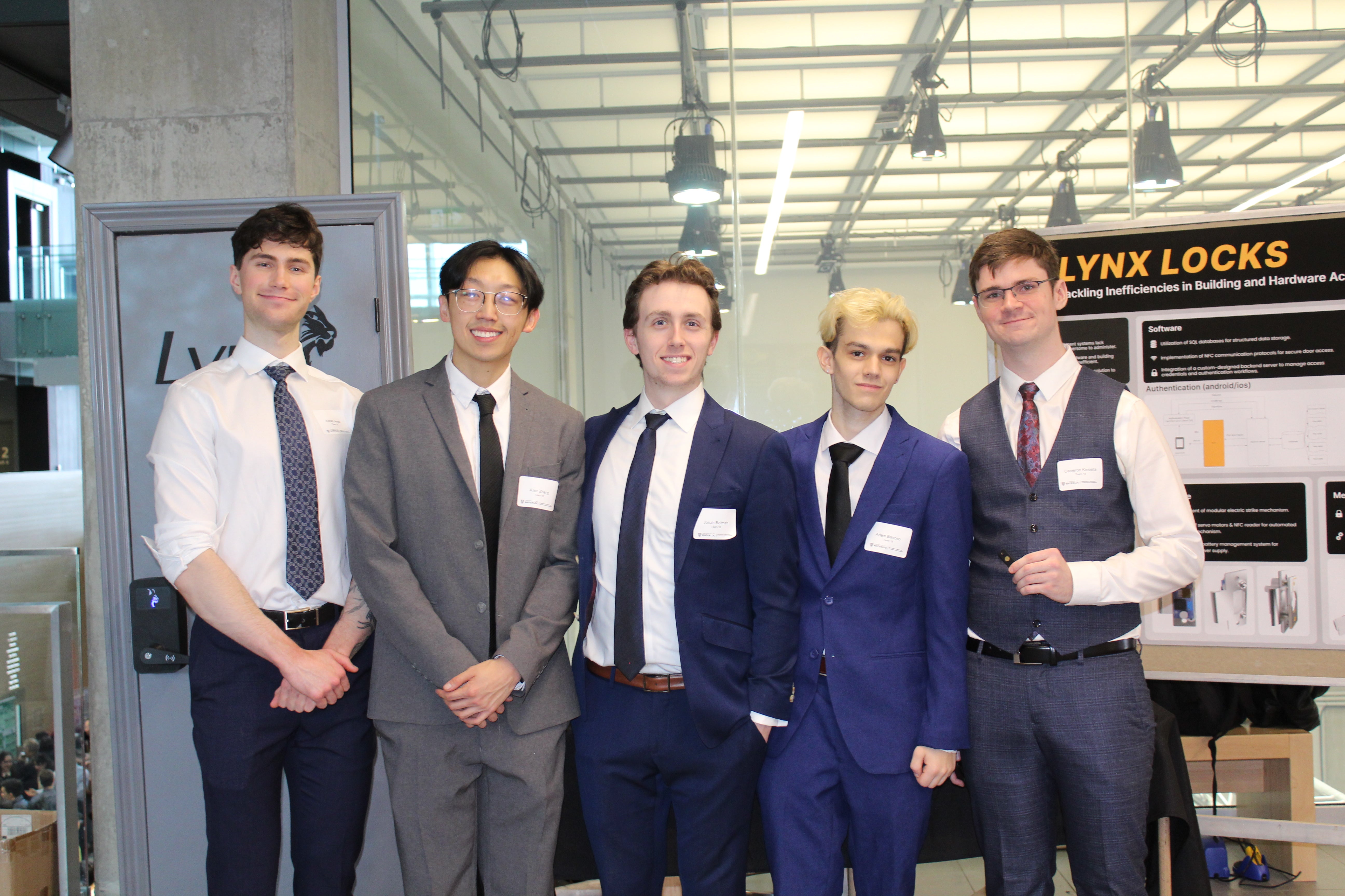 Team Lynx Locks in front of their capstone booth. 