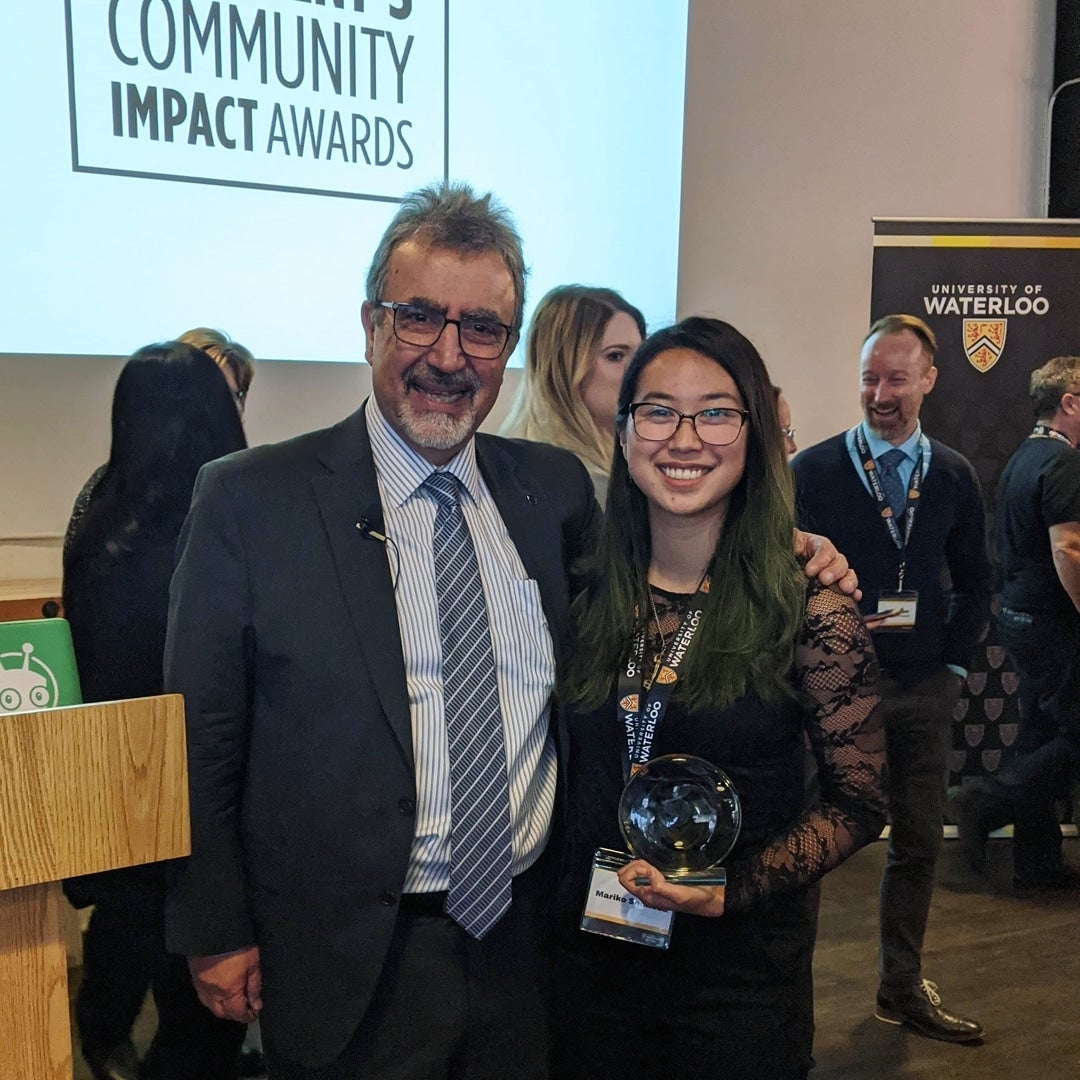 Mariko Shimoda with Feridun Hamdullahpur,  President and Vice-Chancellor, after receiving one of two Community Leader awards through the President's Community Impact Awards Initiative.