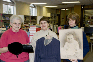 Two donors donating their belongings to Laureen for the Mennonite Archives of Ontario.