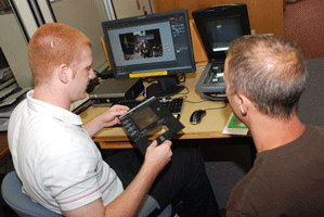 A person preserving information from a floppy disk.