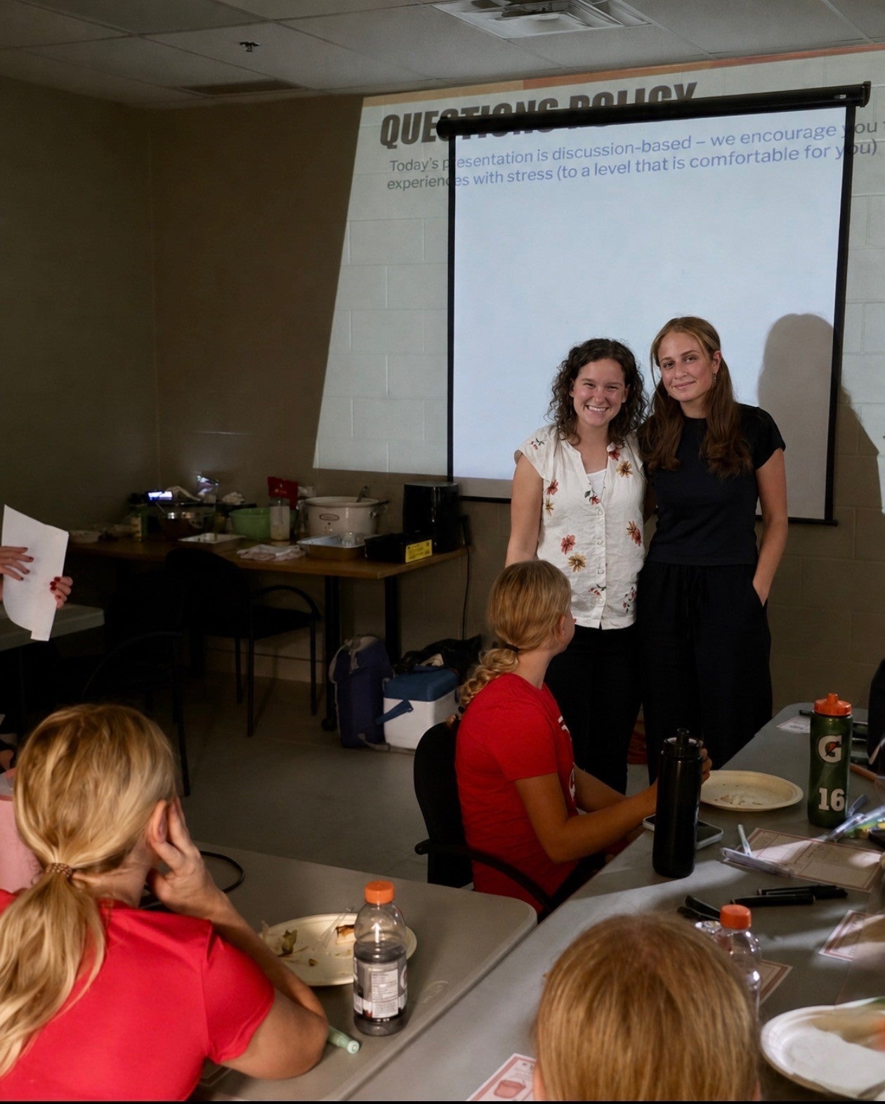 Grad students Aliya McNeil and Jana El-Sabbagh presenting