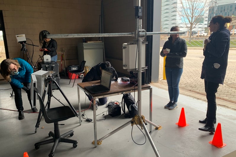 Participants step around a 3D ultrasonic anemometer.