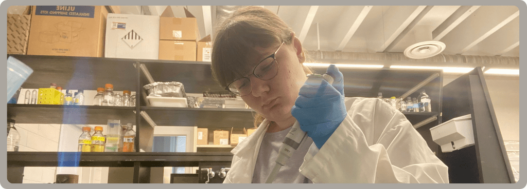 Ellie Harrison in the lab conducting DNA extraction.