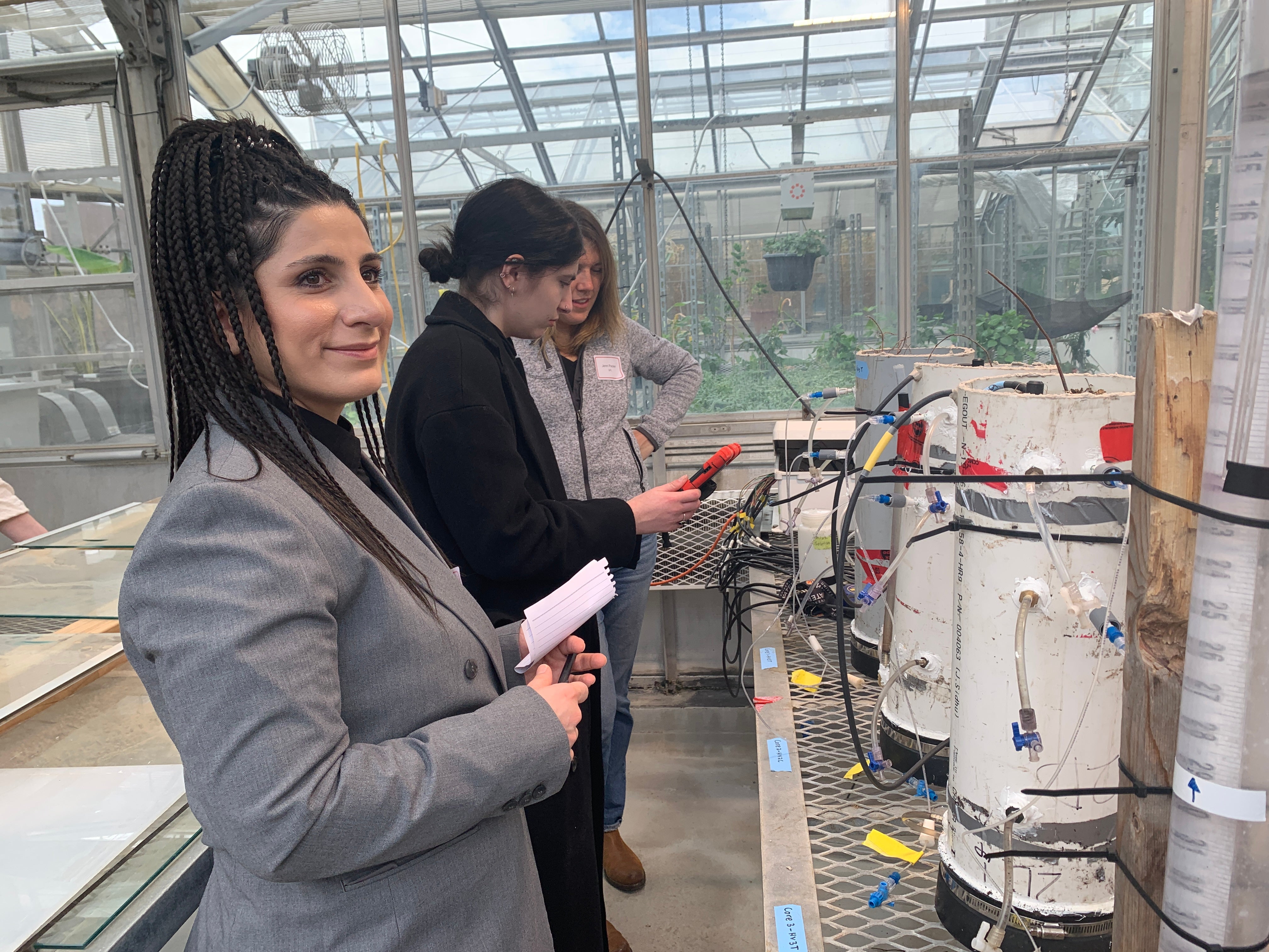 Workshop participants looking at methane flux experiments.