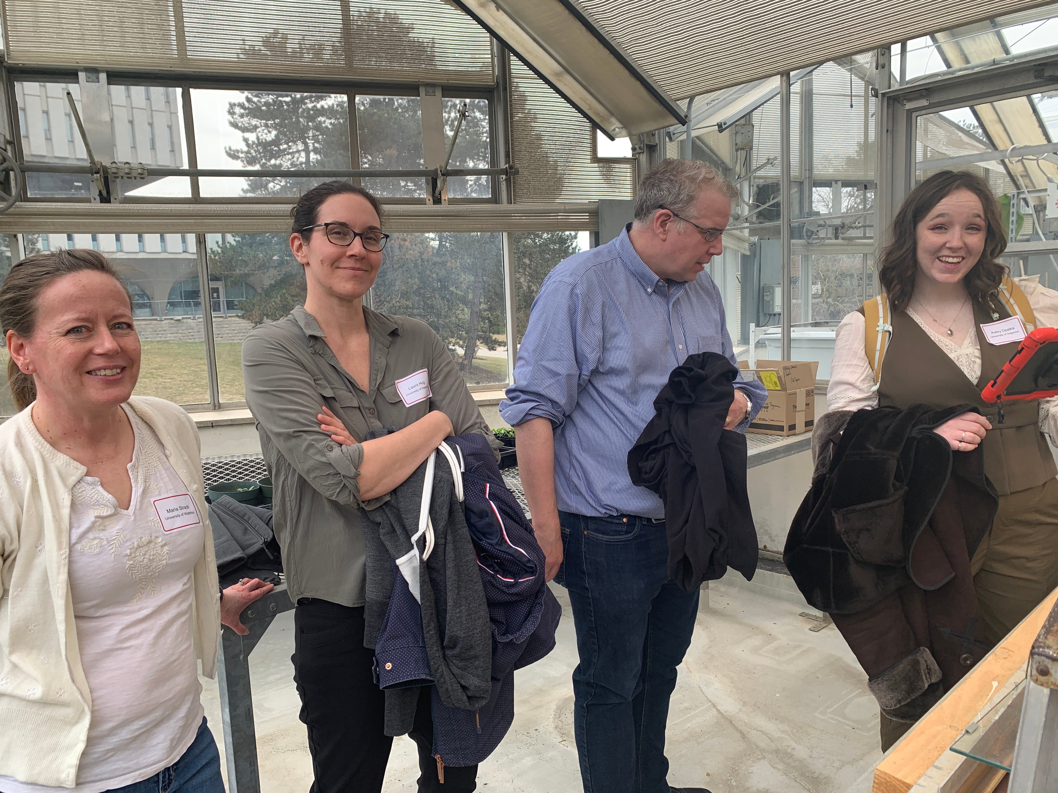 Project team members in the greenhouse.