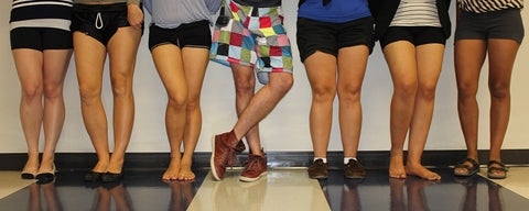 The legs of people in shorts.