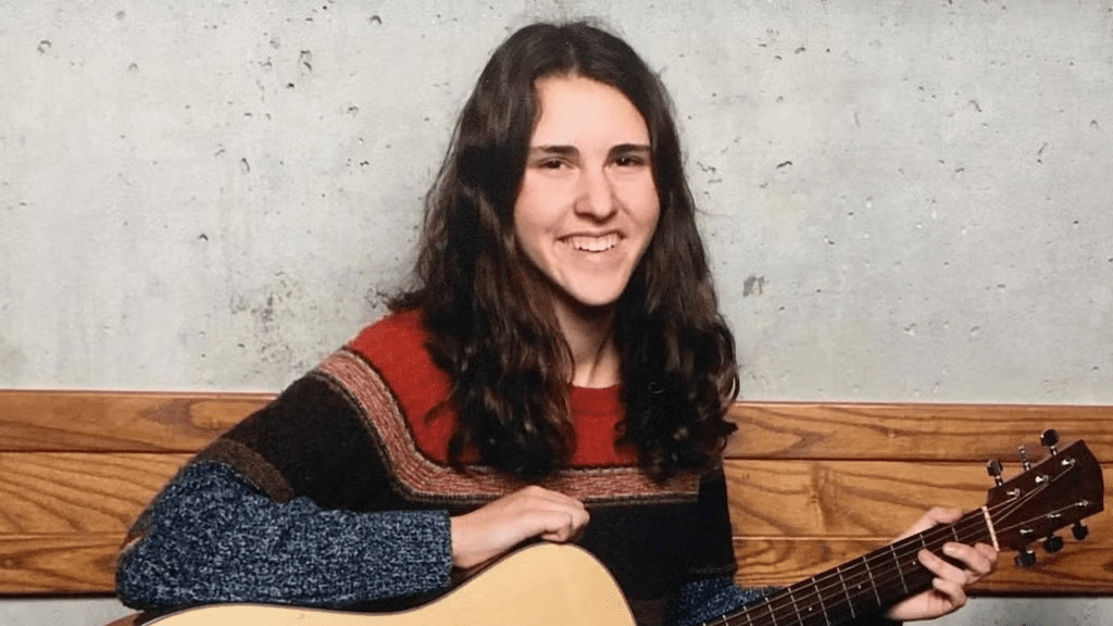 Tessa playing guitar