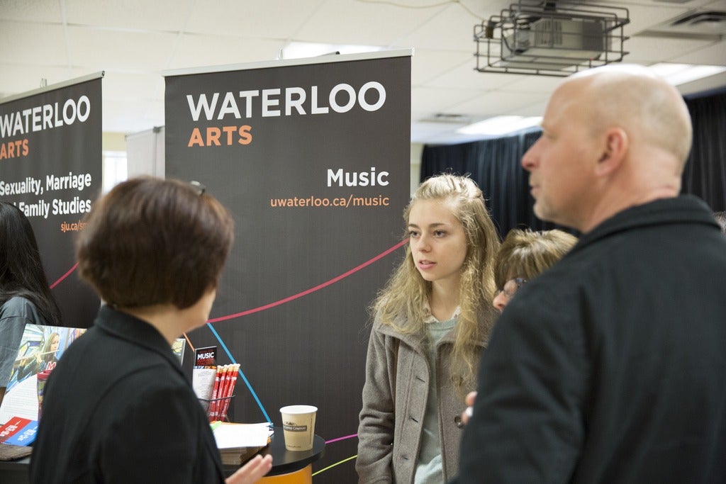Laura and prospective student and parent at open house
