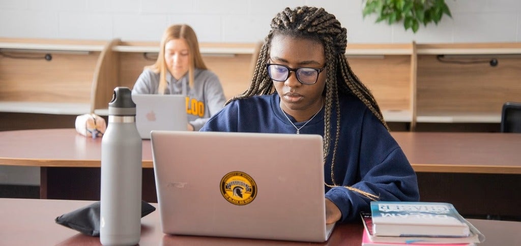 student on computer for application
