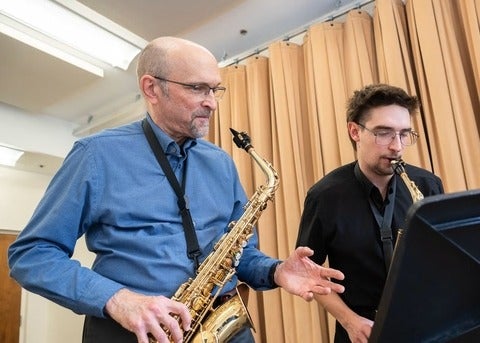 Ernie Kalwa teaching student saxophone
