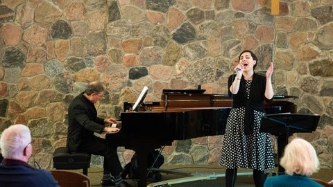 Mary-Catherine Pazzano sings while Paul Stouffer plays piano