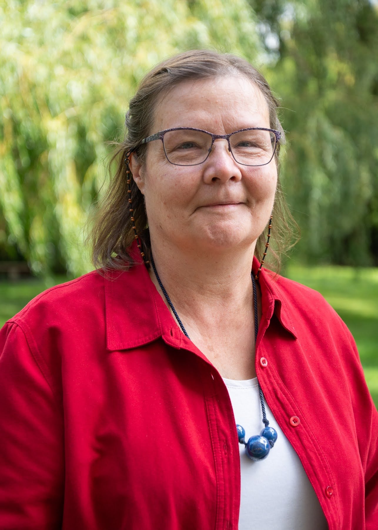 Angelica Allen headshot outside Grebel red top