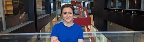 woman in a blue shirt smiling