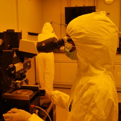 person working in a cleanroom
