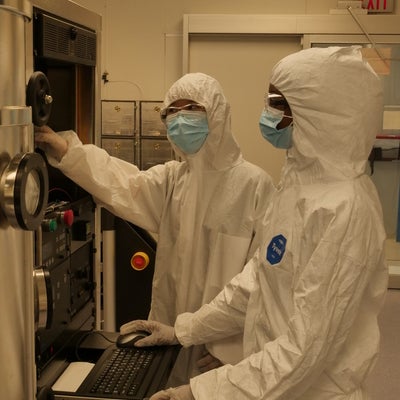 Two technicians working in the cleanroom