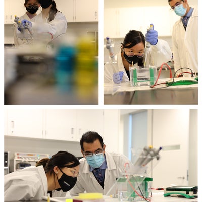 Two people working in the lab.