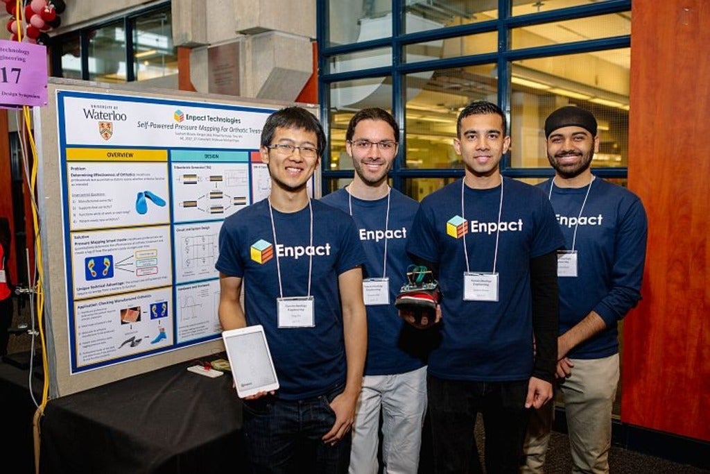 Students with poster at the 2017 Capstone Design Symposium
