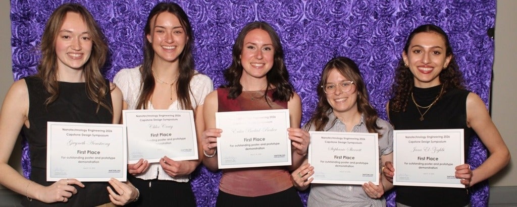 five women smiling holding certificates 