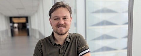 a man with a beard and moustache smiling