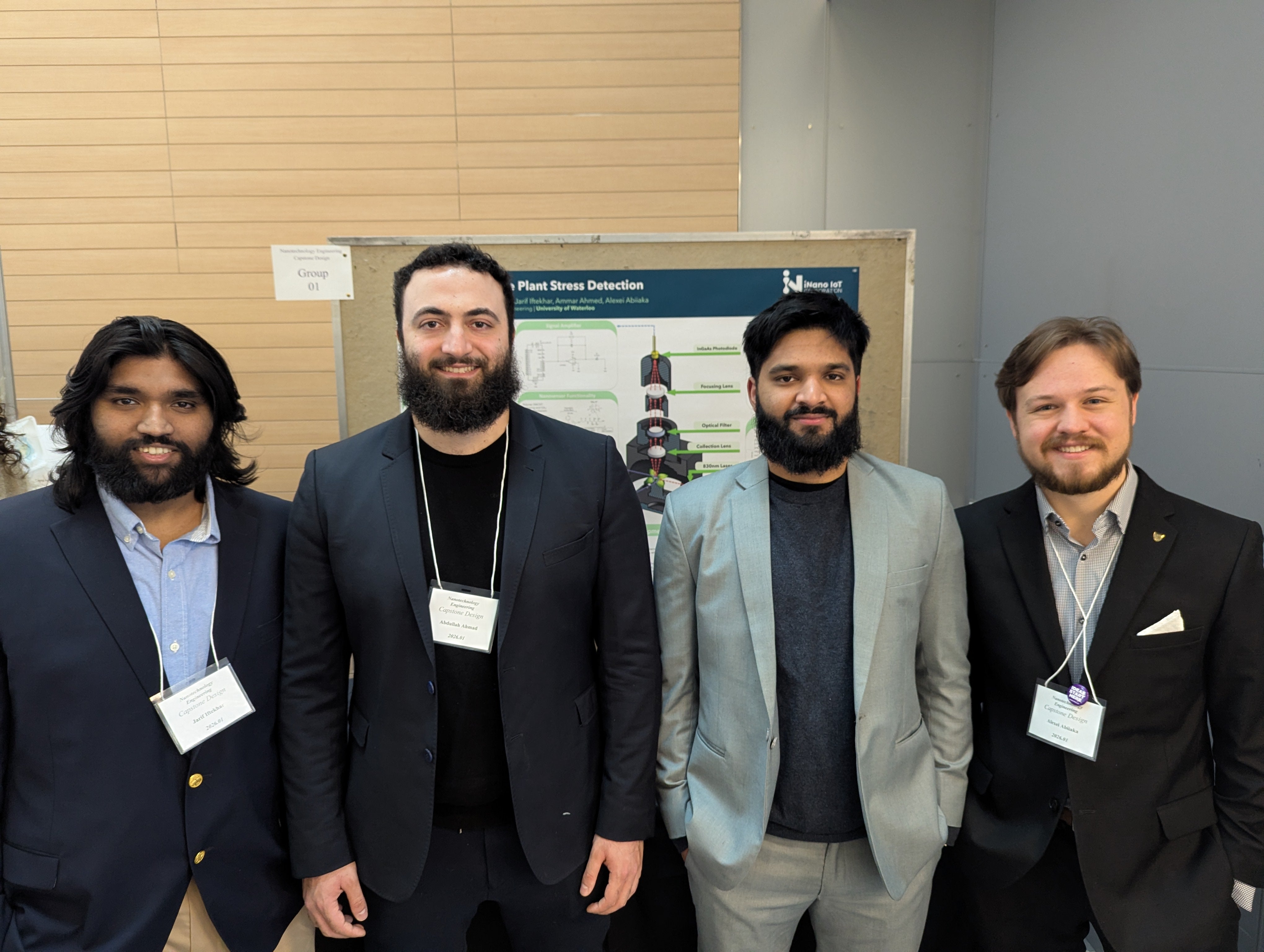 Four men smiling 