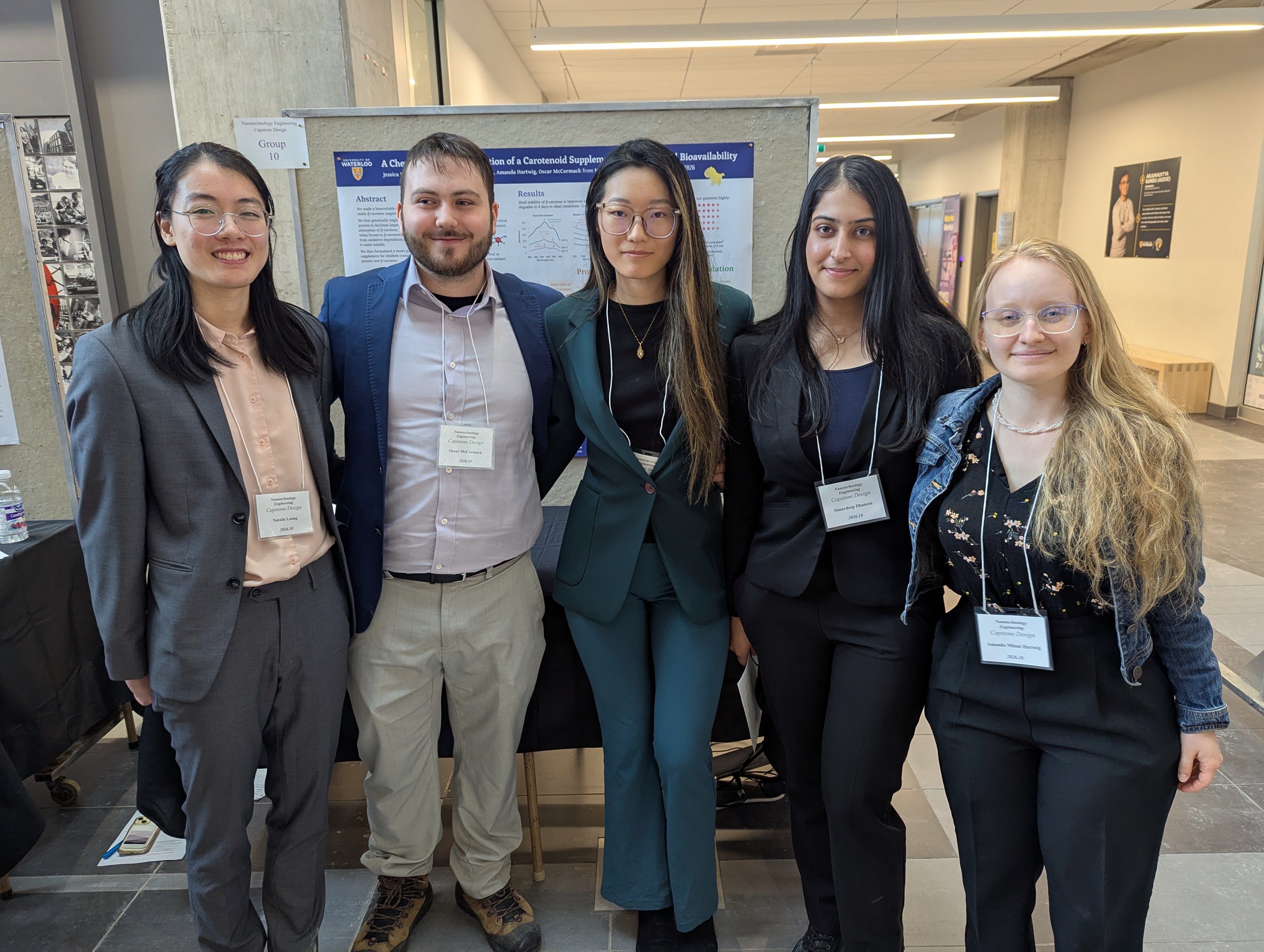 three women and a man smiling