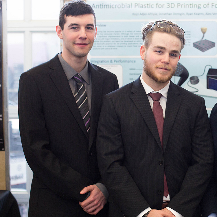 Students and project poster at the 2016 Capstone Design Symposium
