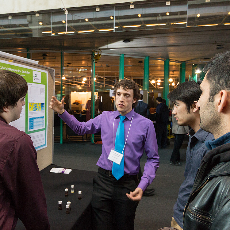 Students and project poster at the 2016 Capstone Design Symposium