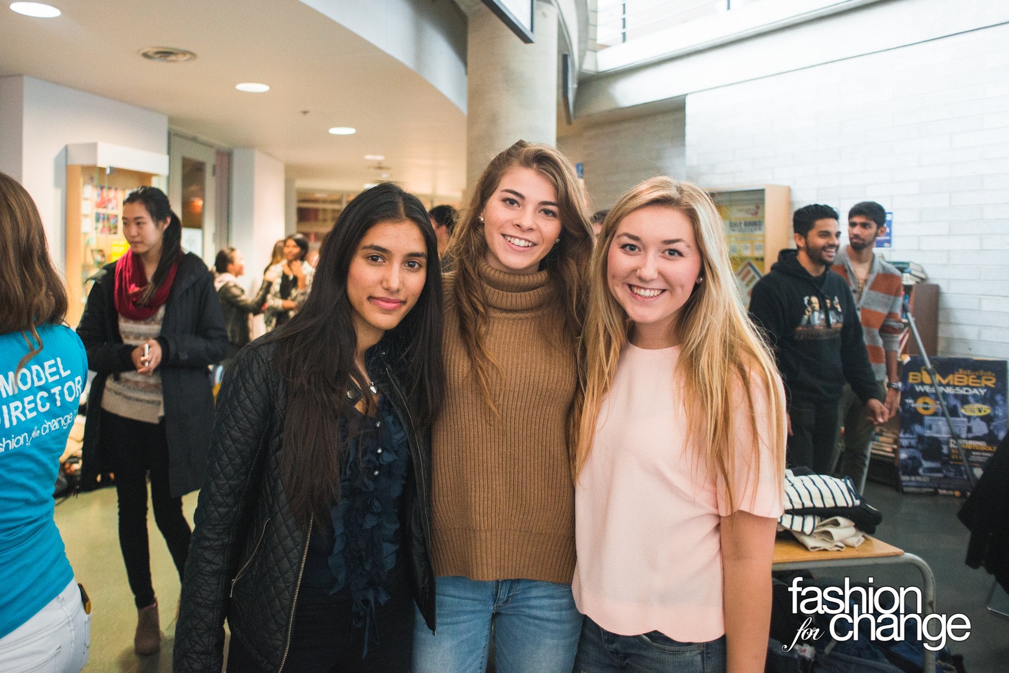 Alisha poses with two friends at a Fashion for Change event.