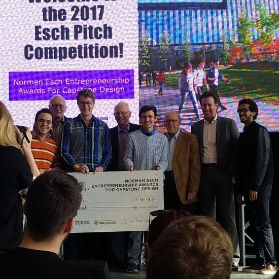 students with cheque at the 2017 Capstone Design Symposium