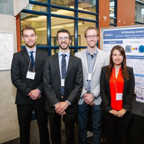 students with poster at the 2017 Capstone Design Symposium
