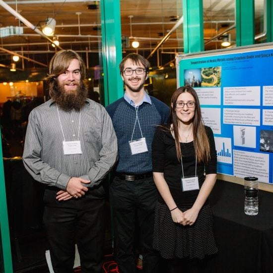 students with poster at the 2017 Capstone Design Symposium