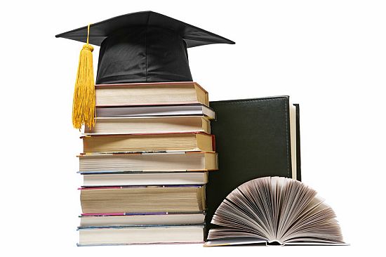 graduation cap and books