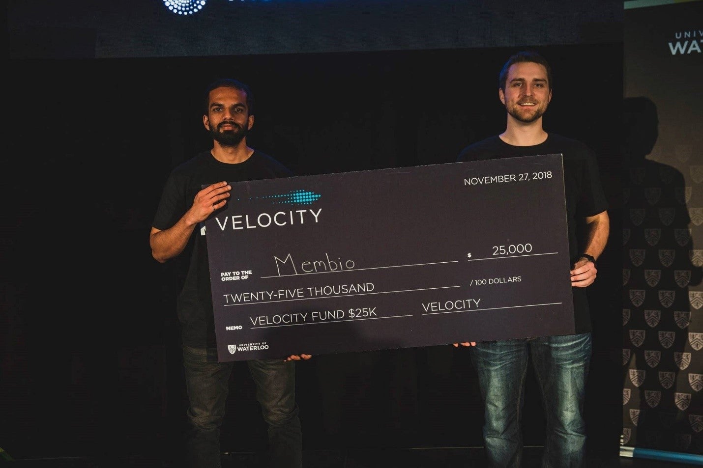 Moin Ahmed and Shane Kilpatrick holding a Velocity Fund Final check for $25,000.