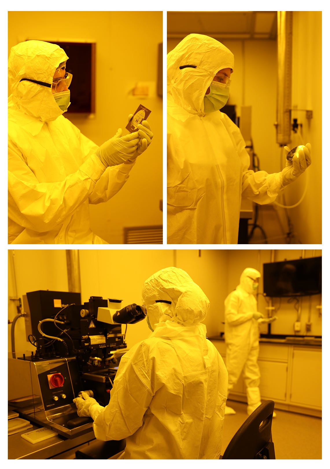 Technicians working in the cleanroom with protective gear on.