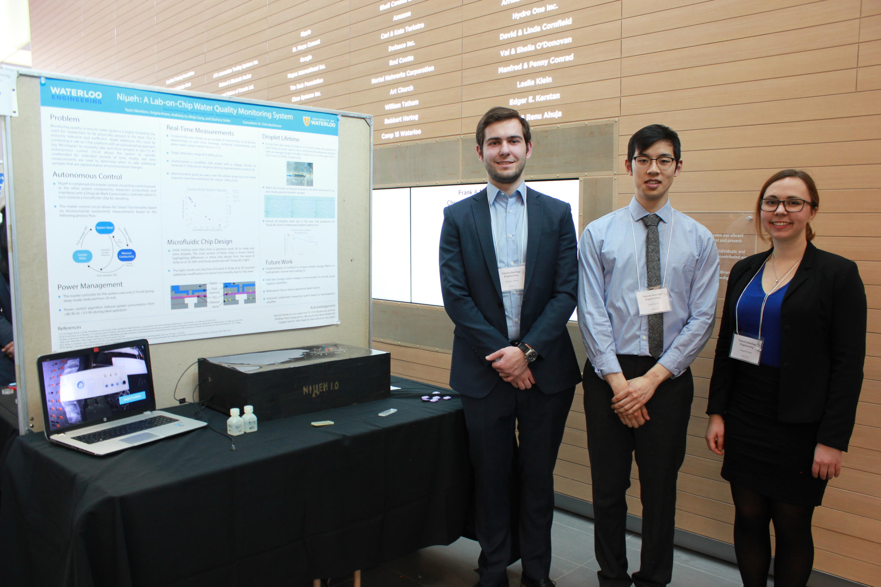 Team 15 students with their project poster at the 2019 Capstone Design Symposium.