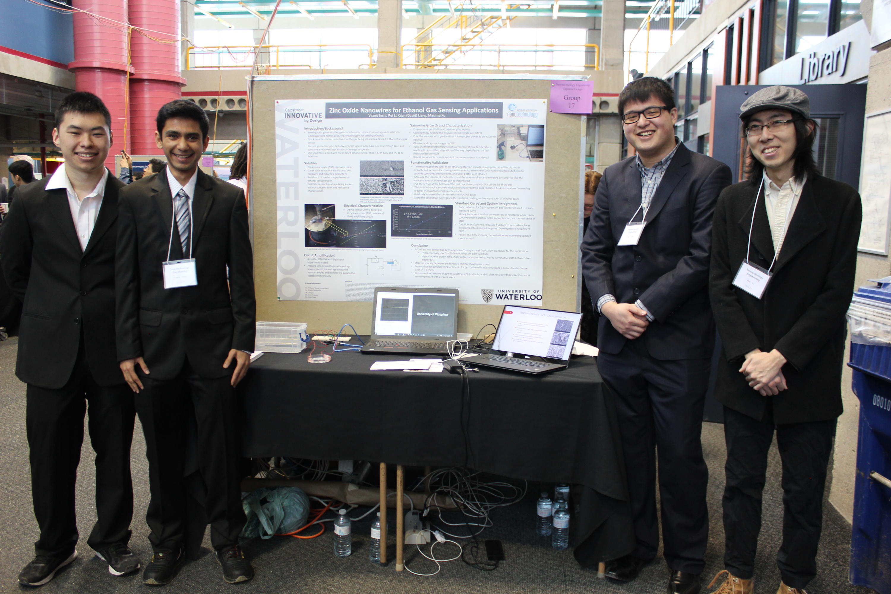 Students with their project poster at the 2018 Capstone Design Symposium.