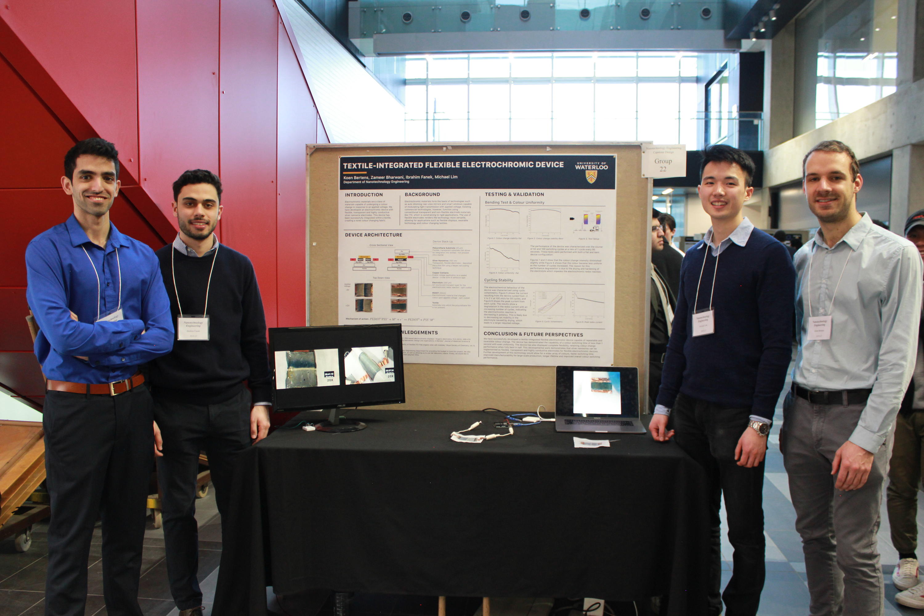 Team 22 students with their project poster at the 2019 Capstone Design Symposium.