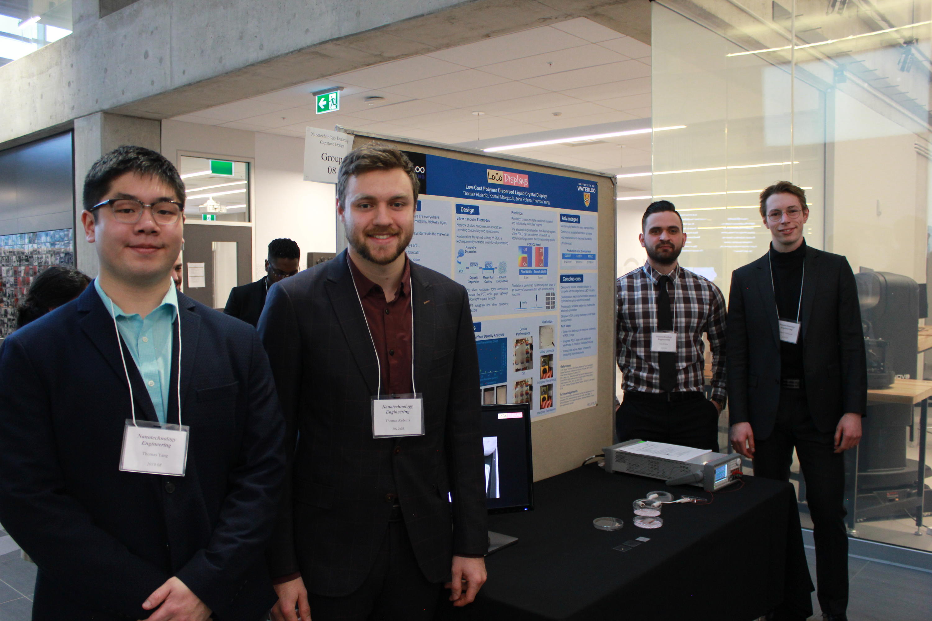 Team 8 students with their project poster at the 2019 Capstone Design Symposium.