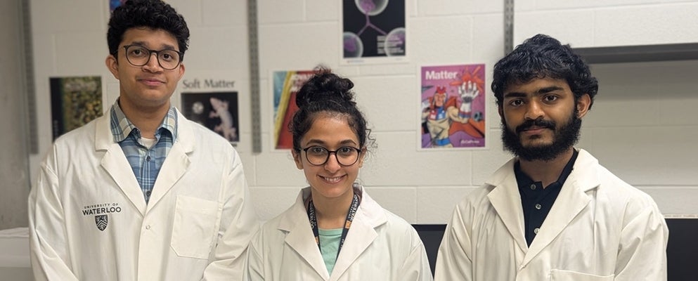 two men and a woman in lab coats
