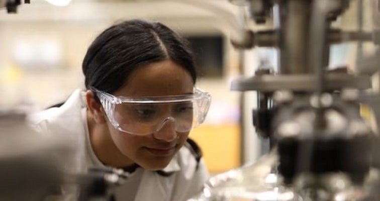 a woman with safety glasses