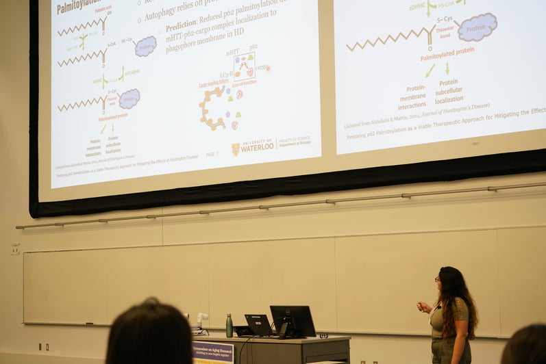 A student presents their work in lecture format at the Symposium on Aging Research 2025.