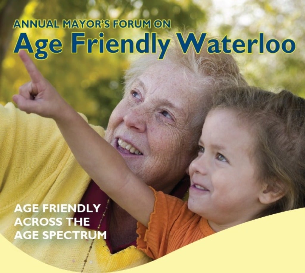 Annual Mayor's forum on Age Friendly Waterloo. Older adult woman and young granddaughter smiling and pointing.