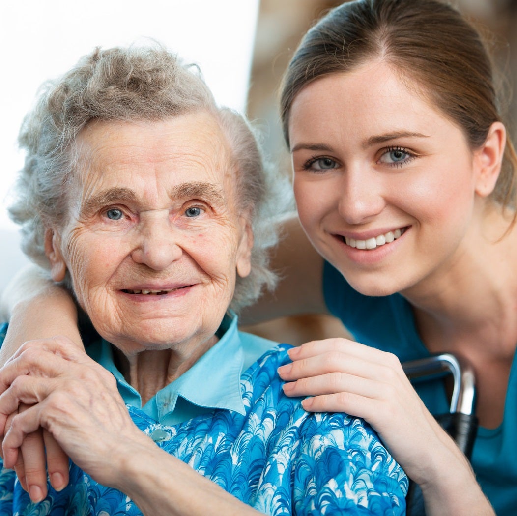 Elderly woman with her caregiver.