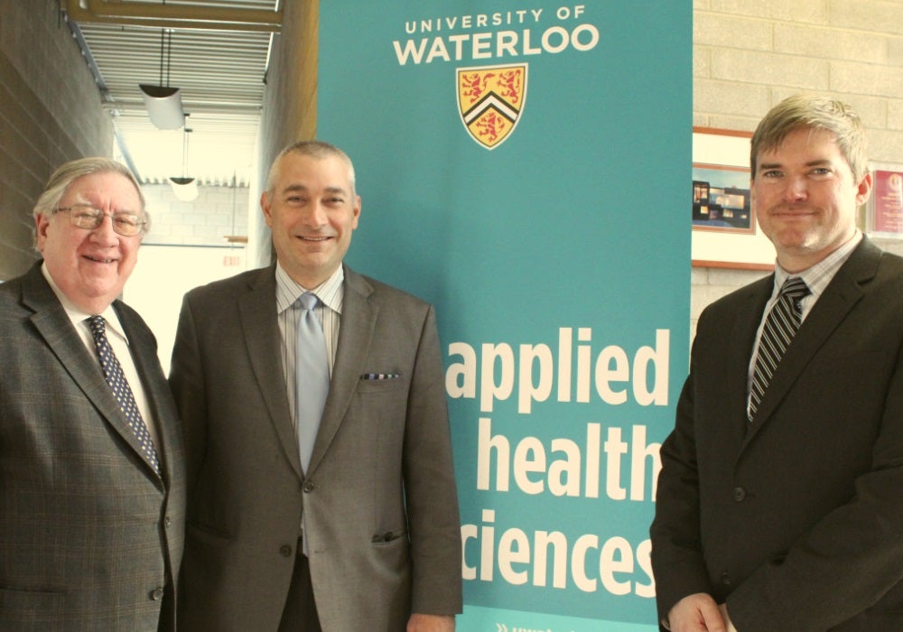 George Dixon, James Rush and Steven Mock in front of banner for Applied Health Sciences.